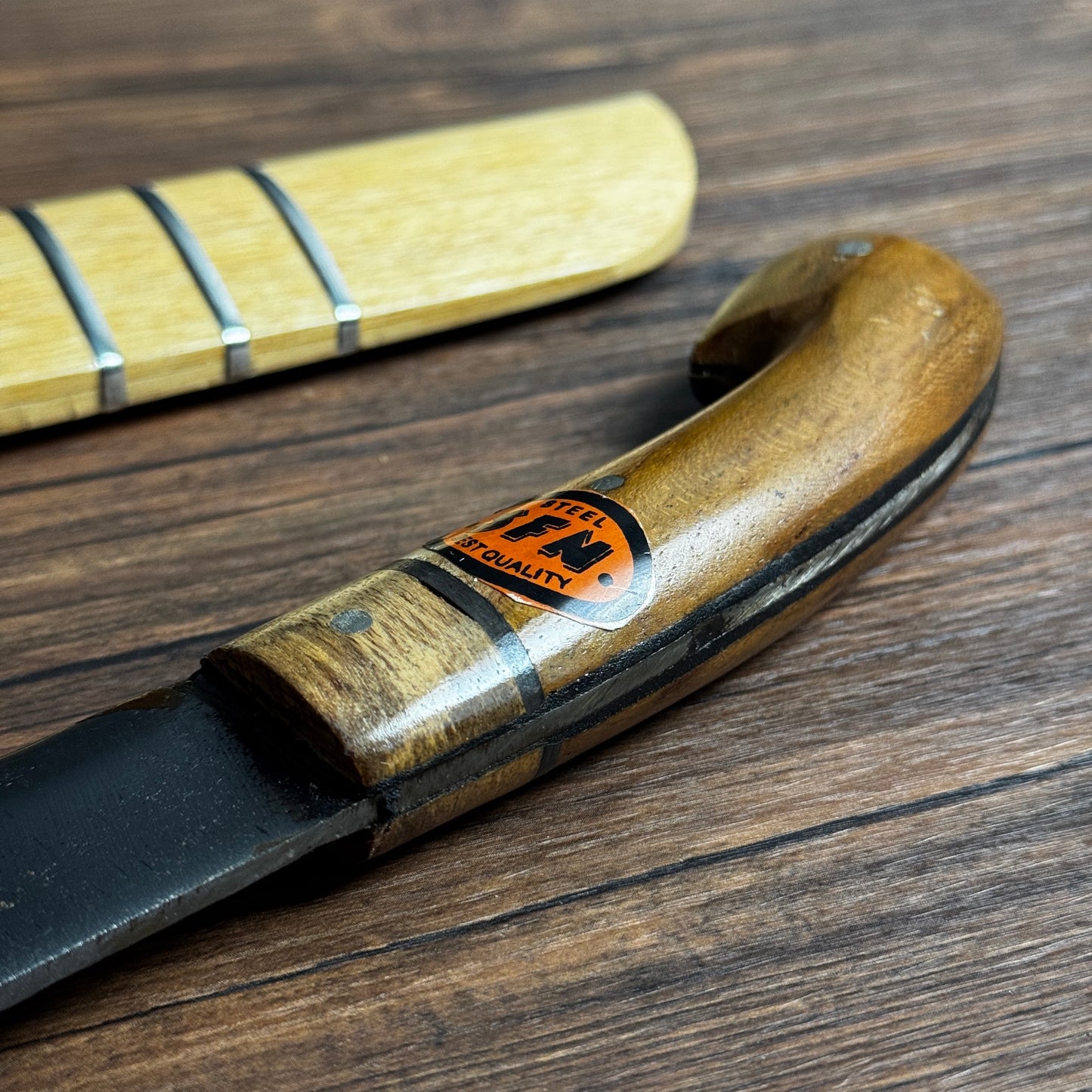 hand carved guava wood sheath hand-forged bushcraft knife traditional indonesian motif