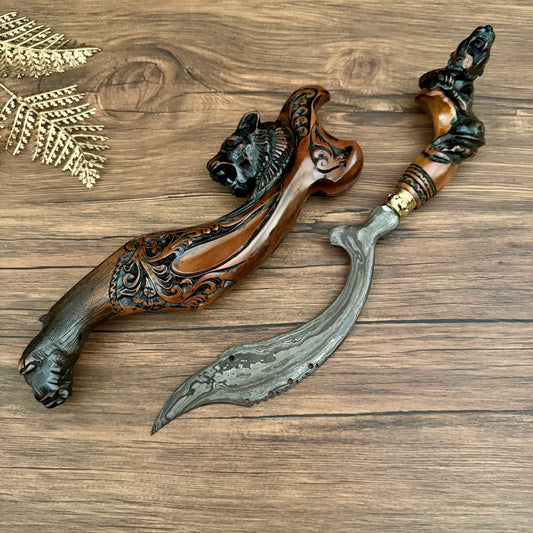 damascus steel hand-forged Indonesian Kujang natural pamor pattern close up