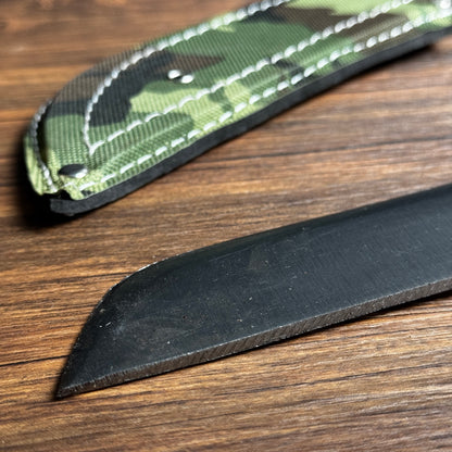 hand forged Indonesian golok machete carbon steel blade close up detail