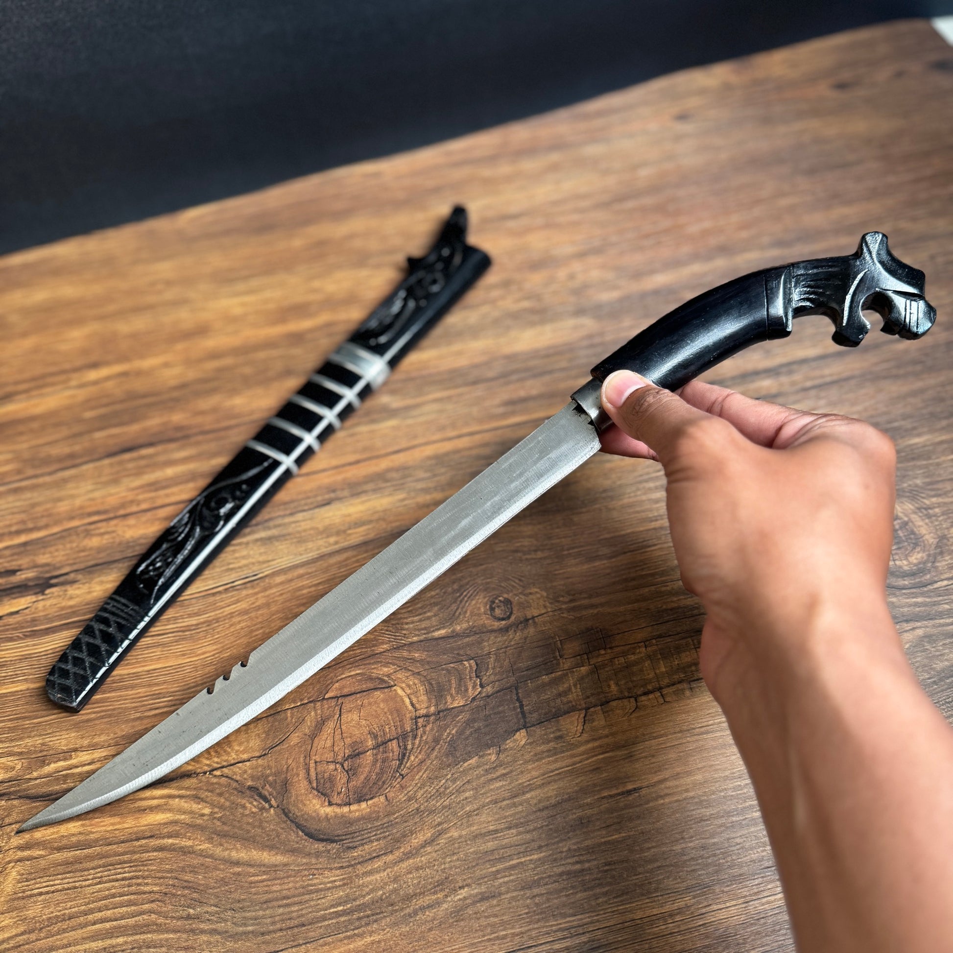 carved wooden handle Indonesian parang machete traditional hand carved detail view