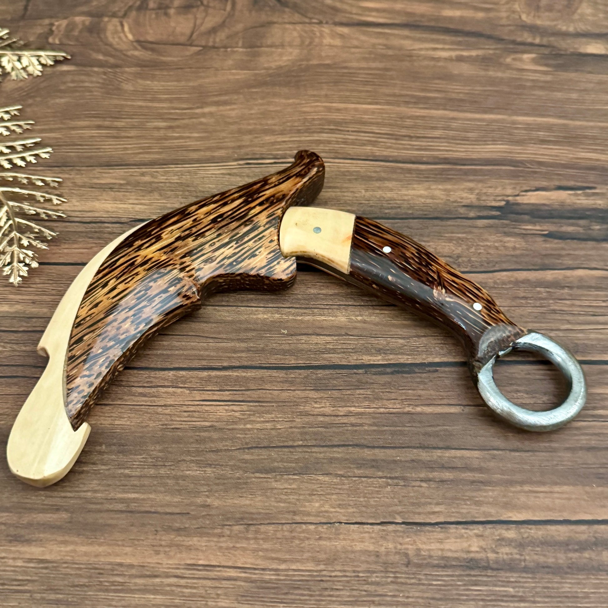 palm wood handle hand-forged karambit knife traditional hand carved detail view