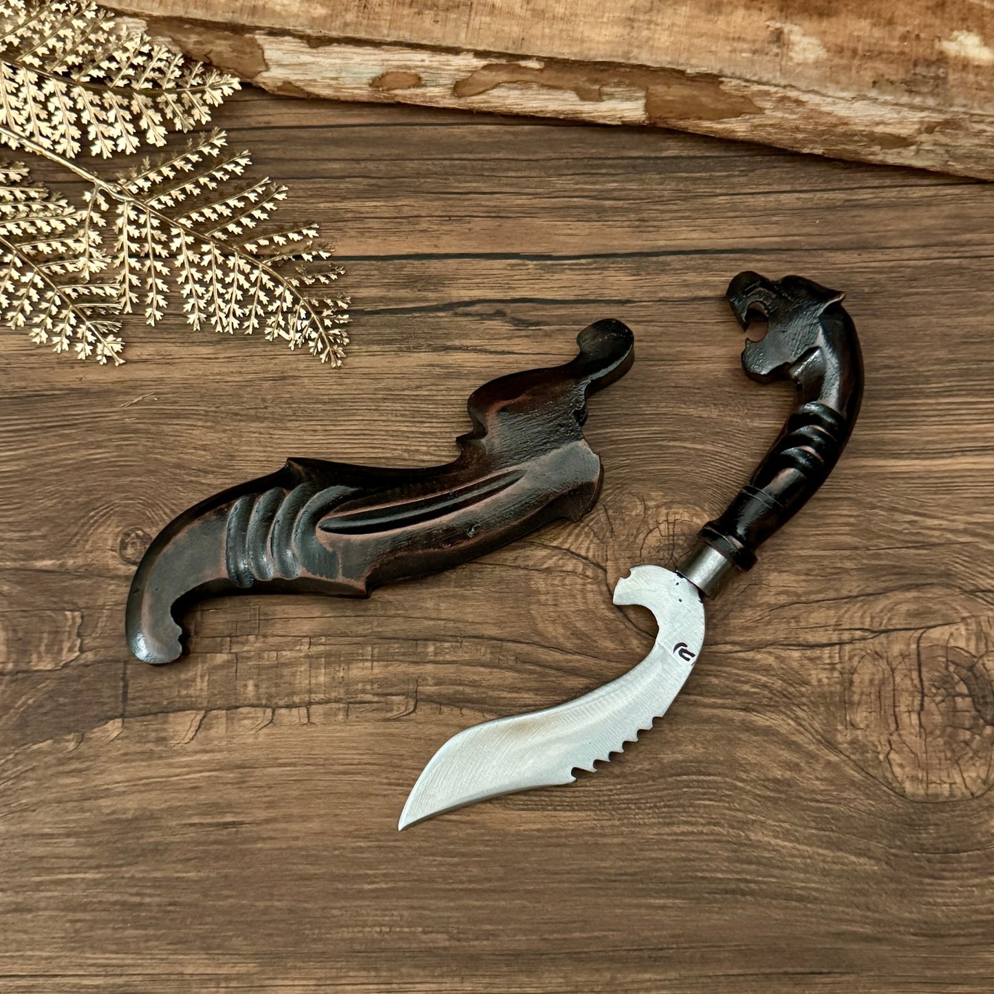 hand carved black wood handle hand-forged Indonesian Kujang traditional detail view