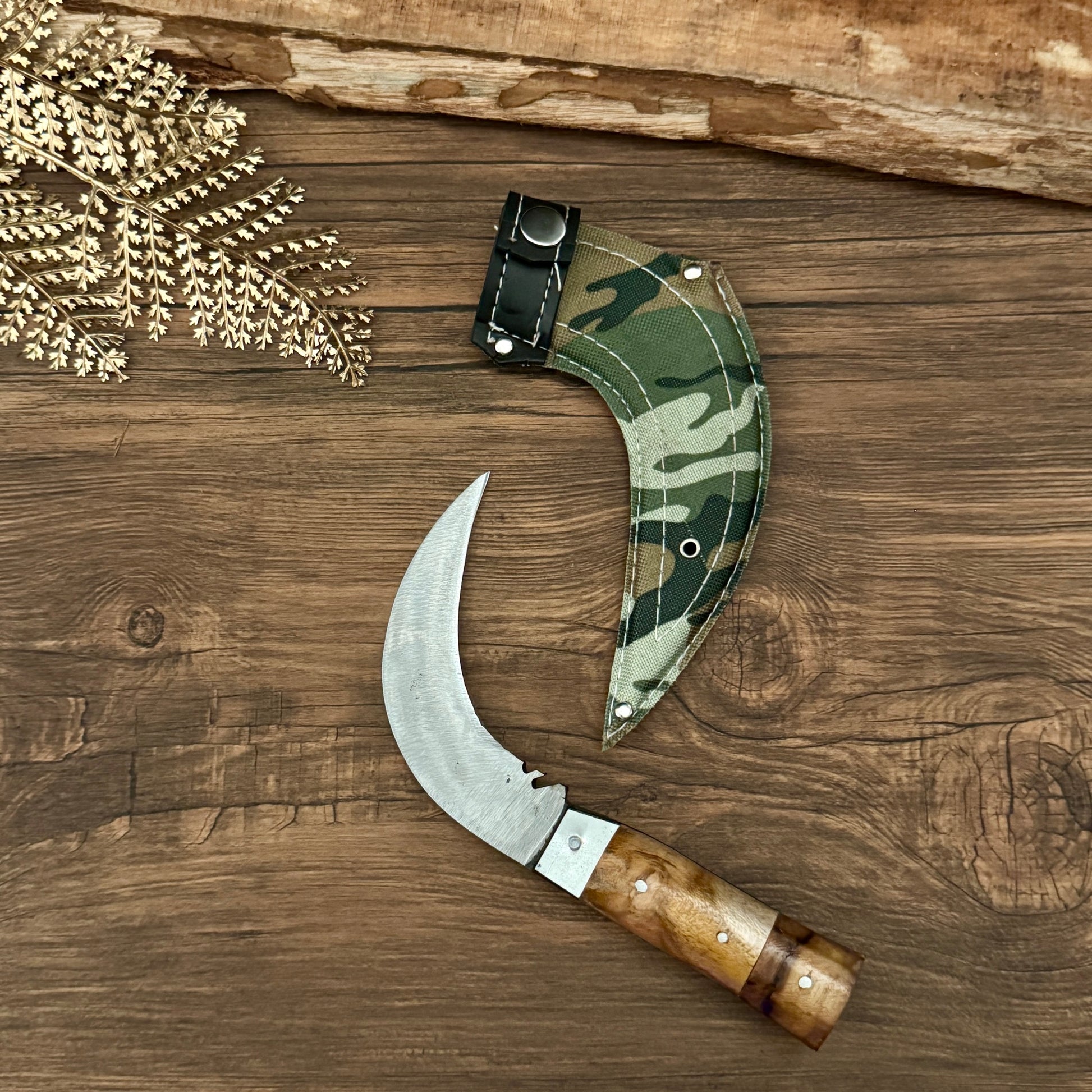 paracord handle hand-forged karambit knife traditional Indonesian tiger claw detail