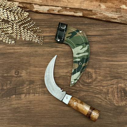 paracord handle hand-forged karambit knife traditional Indonesian tiger claw detail