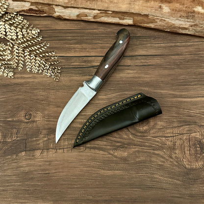 hand-forged bushcraft knife full tang blade forging marks close up