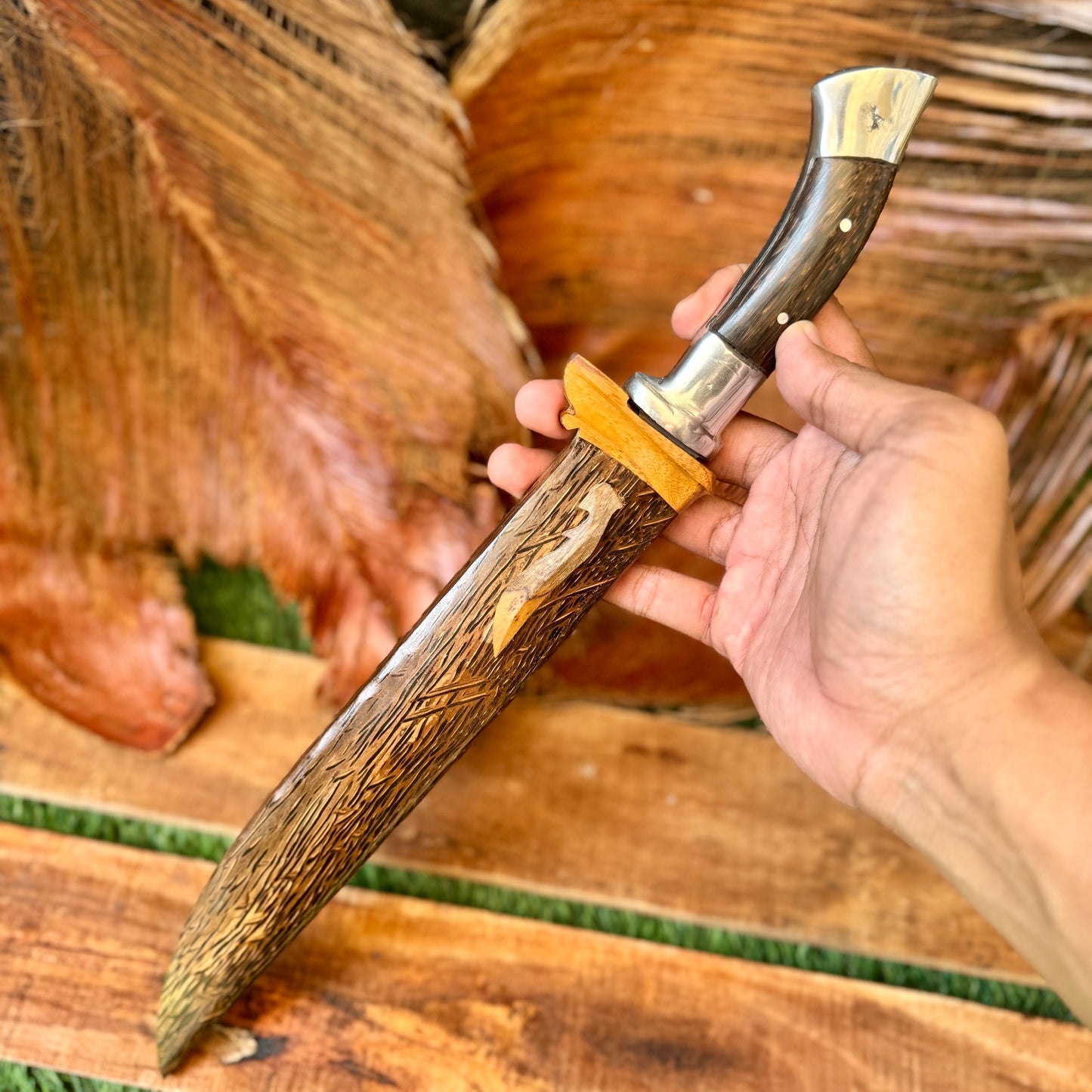palm wood handle hand-forged golok machete traditional Indonesian carved detail