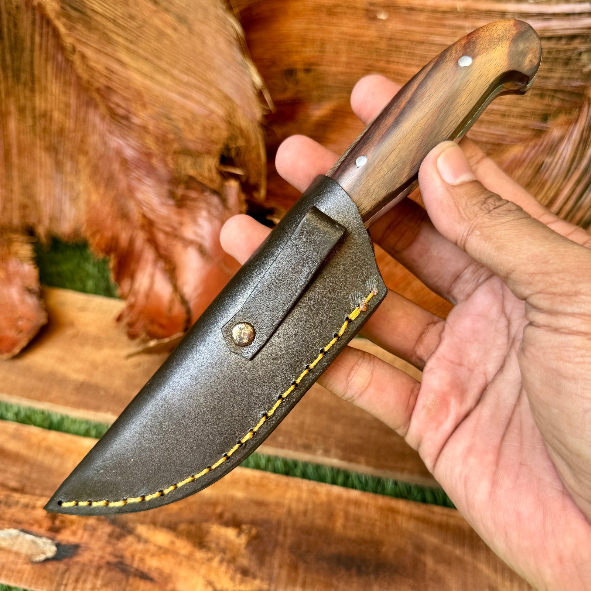 rosewood handle hand-forged bushcraft knife traditional grain detail view
