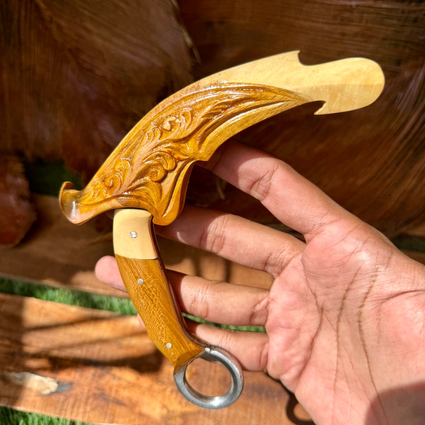 teak handle hand-forged karambit spring steel traditional hand carved detail view