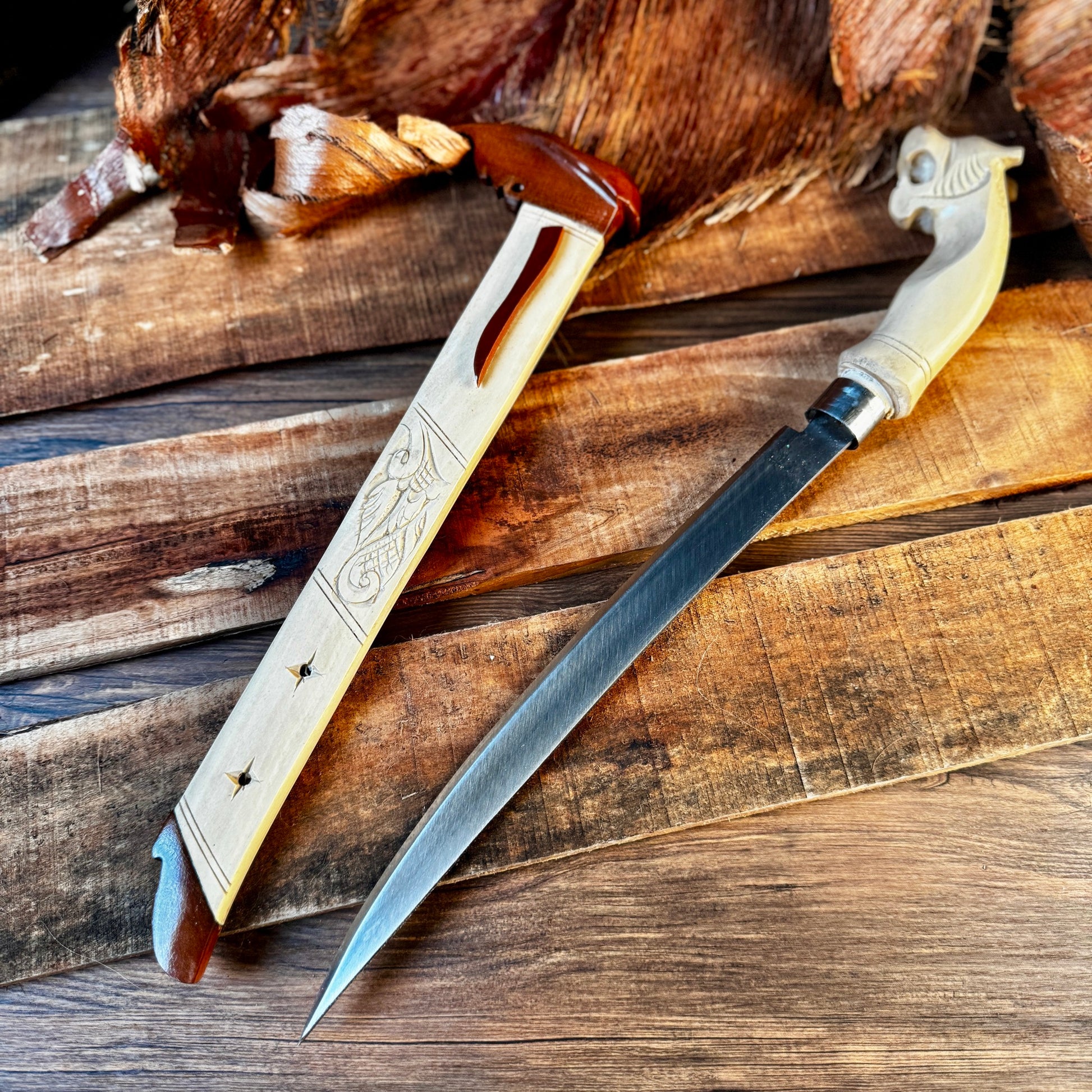 hand-forged Indonesian Laduk knife coffee wood handle traditional carved detail view