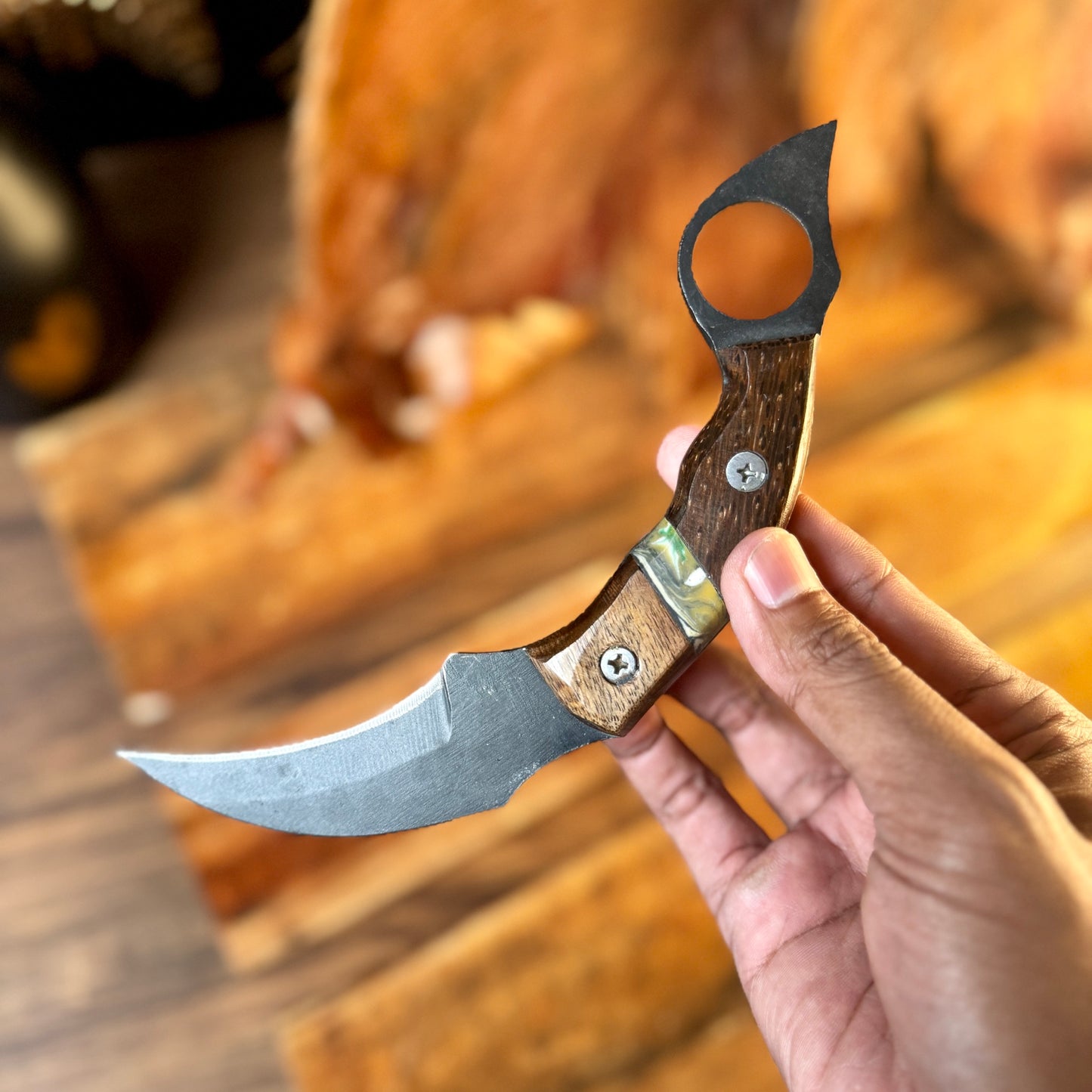 hand-forged karambit with leather sheath embossed leather sheath hand stitched detail
