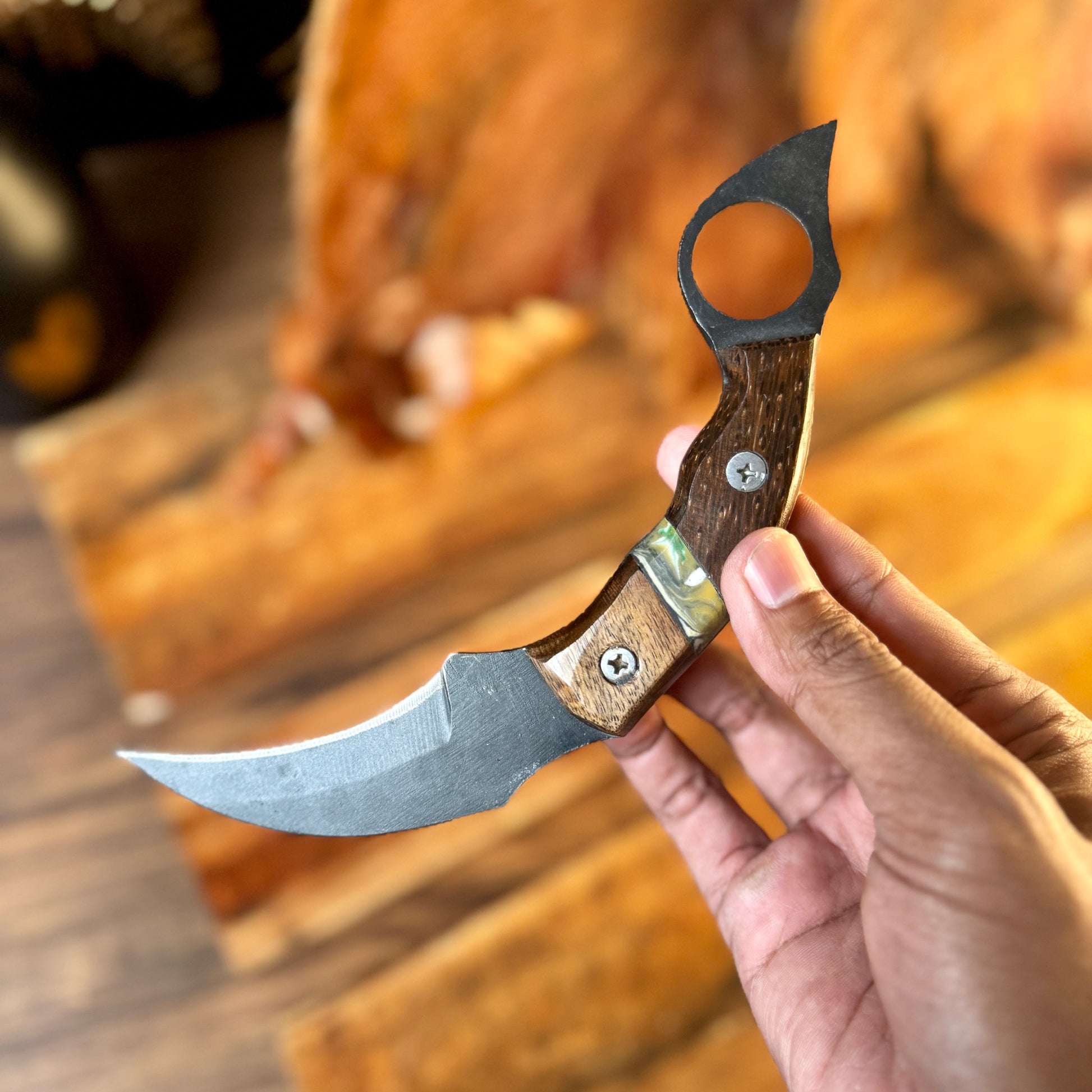 hand-forged karambit with leather sheath embossed leather sheath hand stitched detail