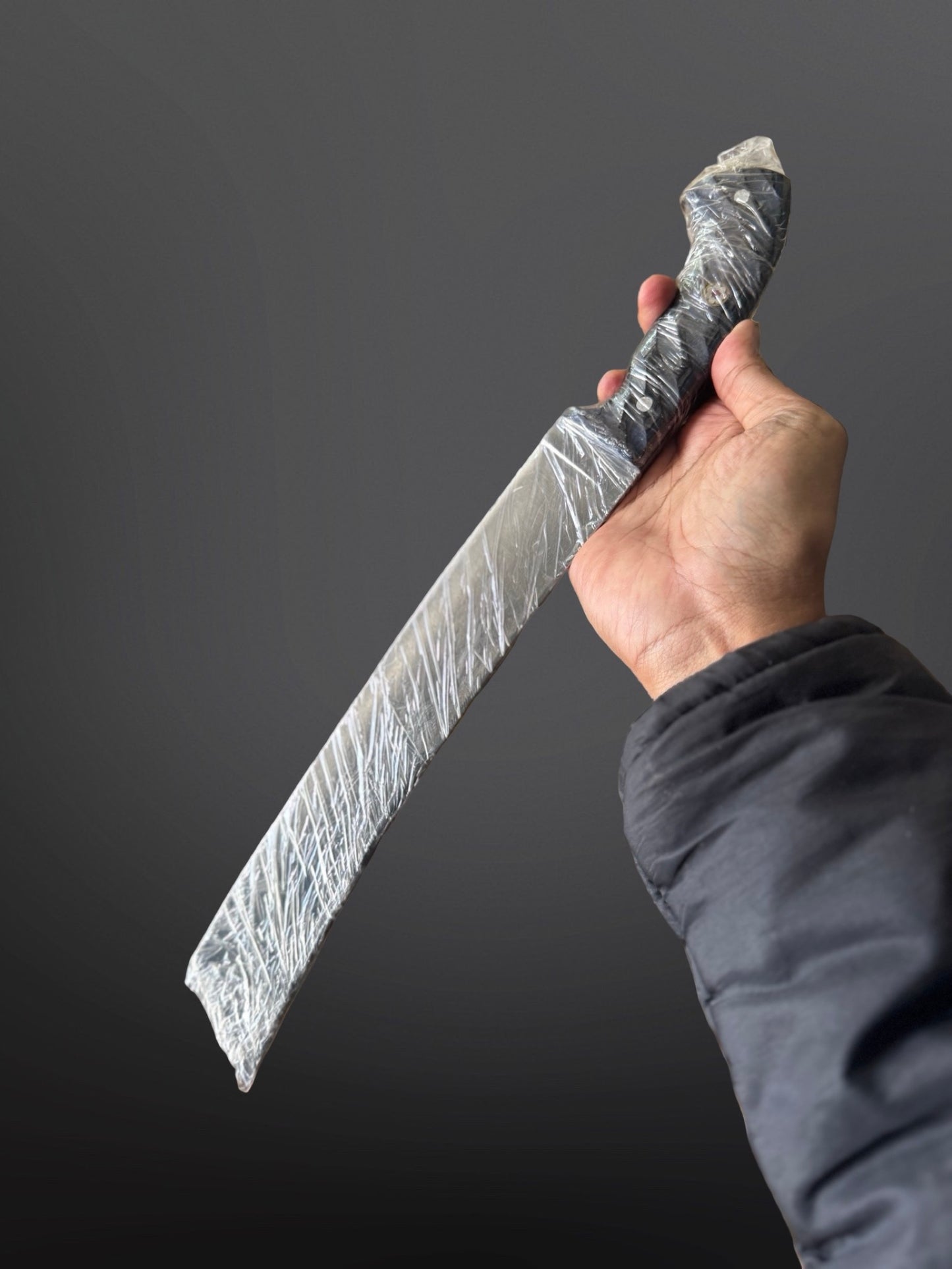 hand-forged parang machete full tang handle rattan woven detail close up